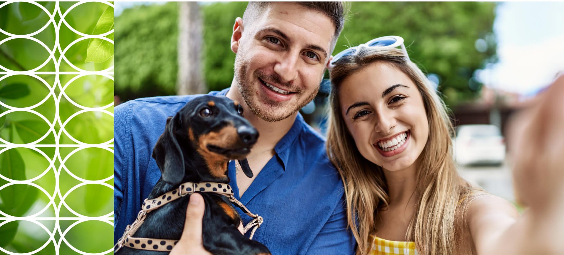 couple holding dog selfie